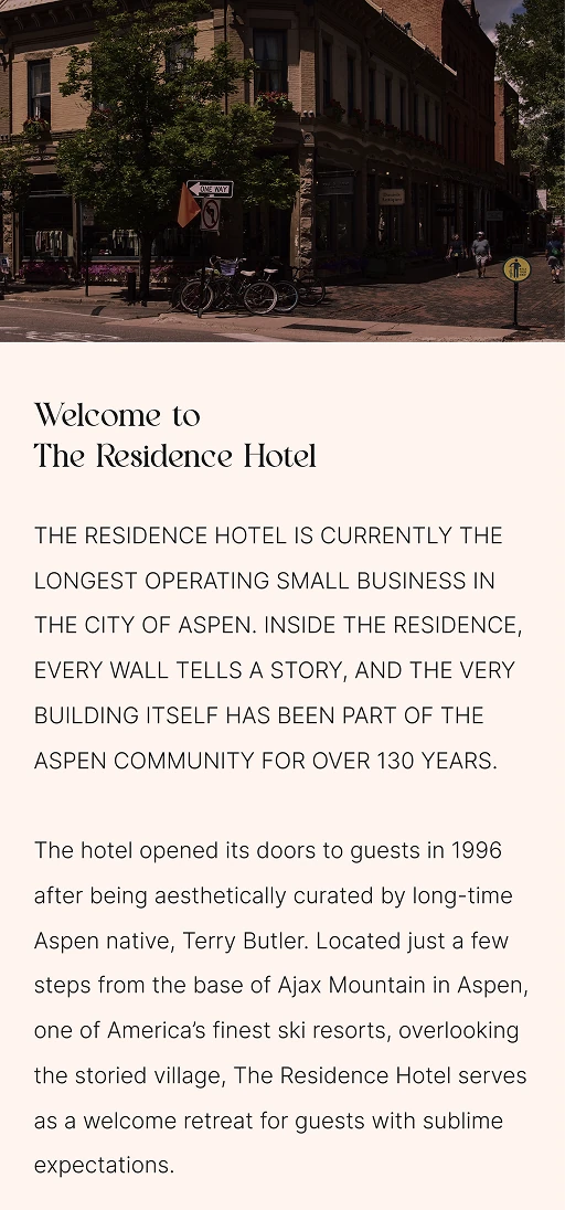 Street view of The Residence Hotel Aspen with welcome text describing its history and location