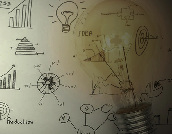 Light bulb with business diagrams and charts representing ideas and strategy
